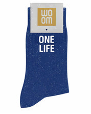 Deep blue glitter message socks with a white jacquard ONE LIFE inscription at the ankle, presented in their original Woom paper packaging.