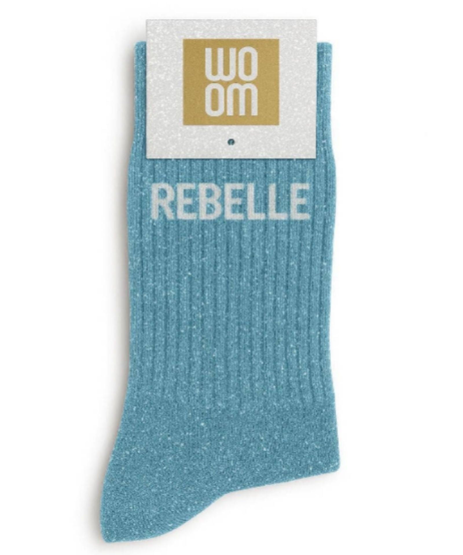 Vibrant turquoise glitter message socks with a white jacquard REBELLE inscription at the ankle, presented in their original Woom paper packaging.