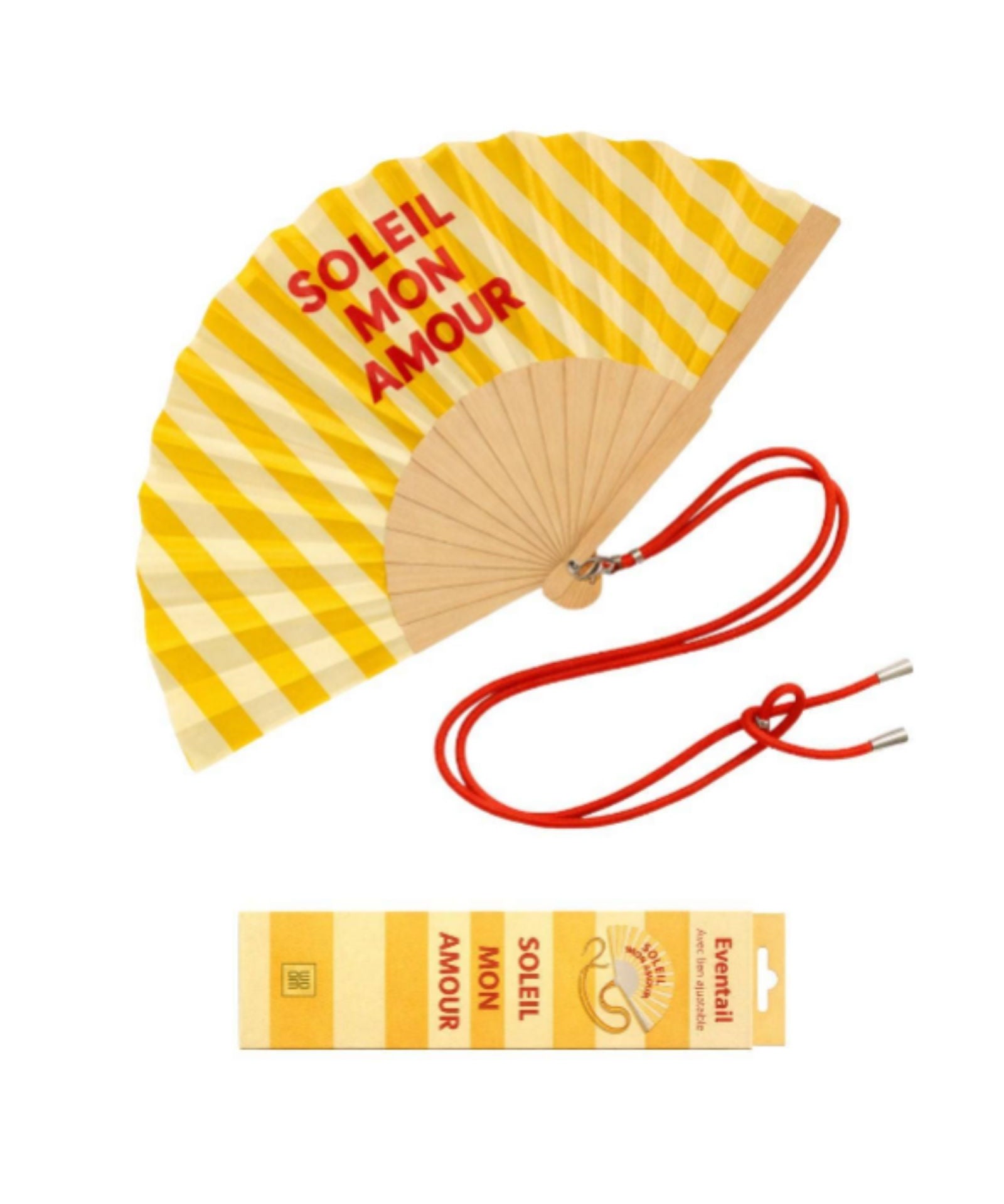 An opened summer folding fan with a vibrant yellow and white striped pattern and "SOLEIL MON AMOUR" text, displayed alongside its matching red shoulder strap and designer gift box.