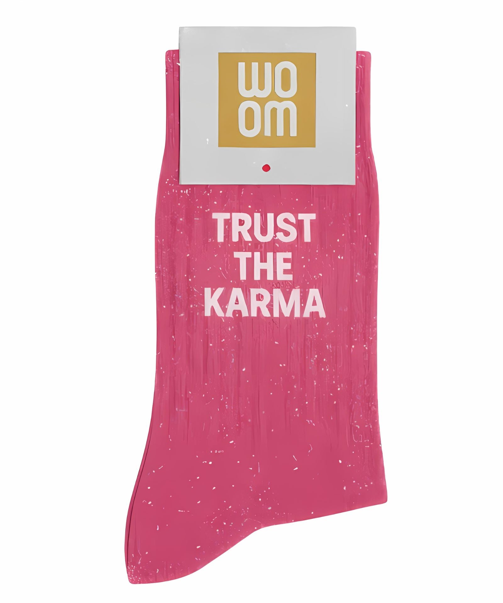 Vibrant pink glitter message socks with a white jacquard TRUST THE KARMA inscription at the ankle, presented in their original Woom paper packaging.