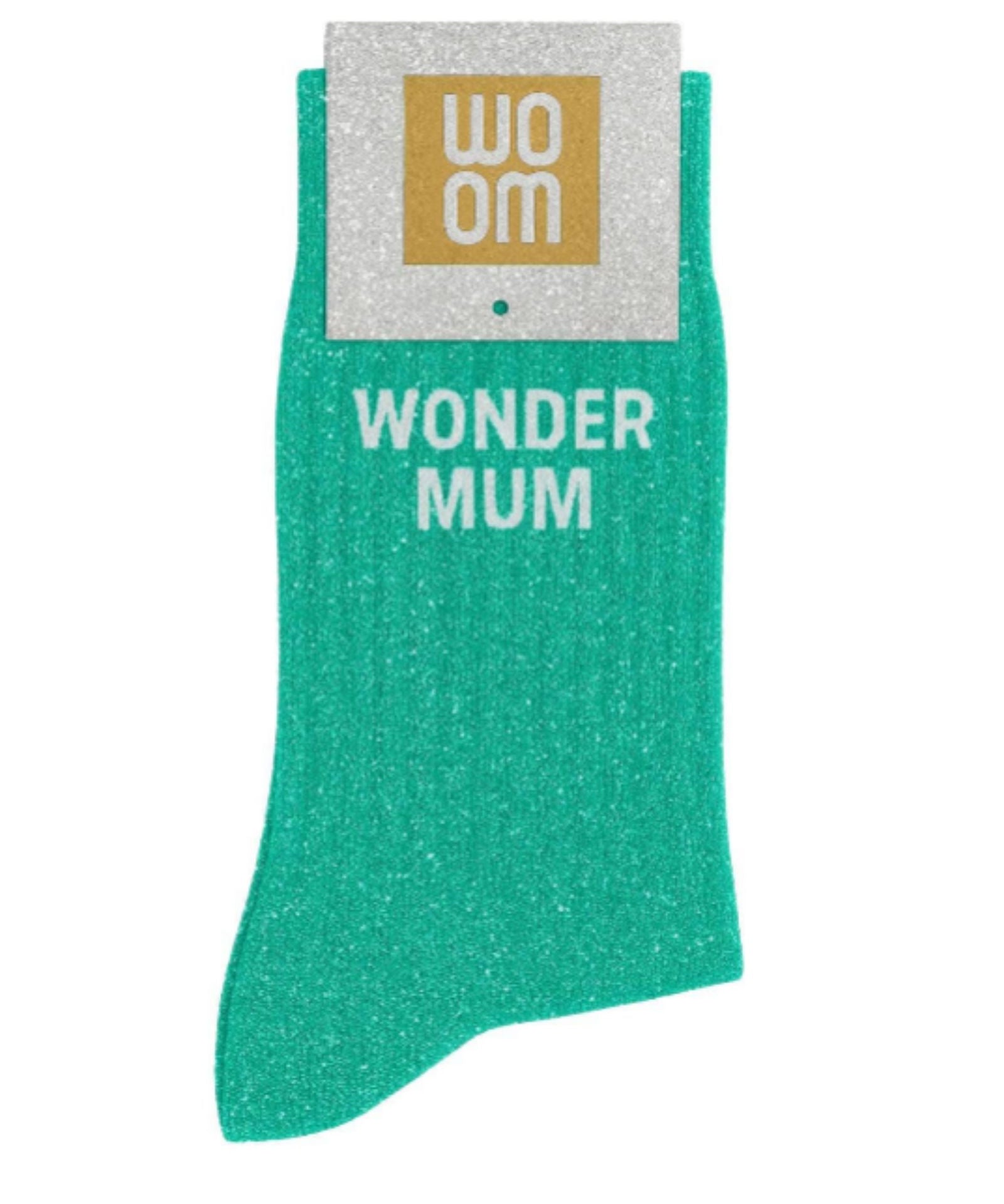 Almond green glitter message socks with a white jacquard WONDER MUM inscription at the ankle, presented in their original Woom paper packaging.