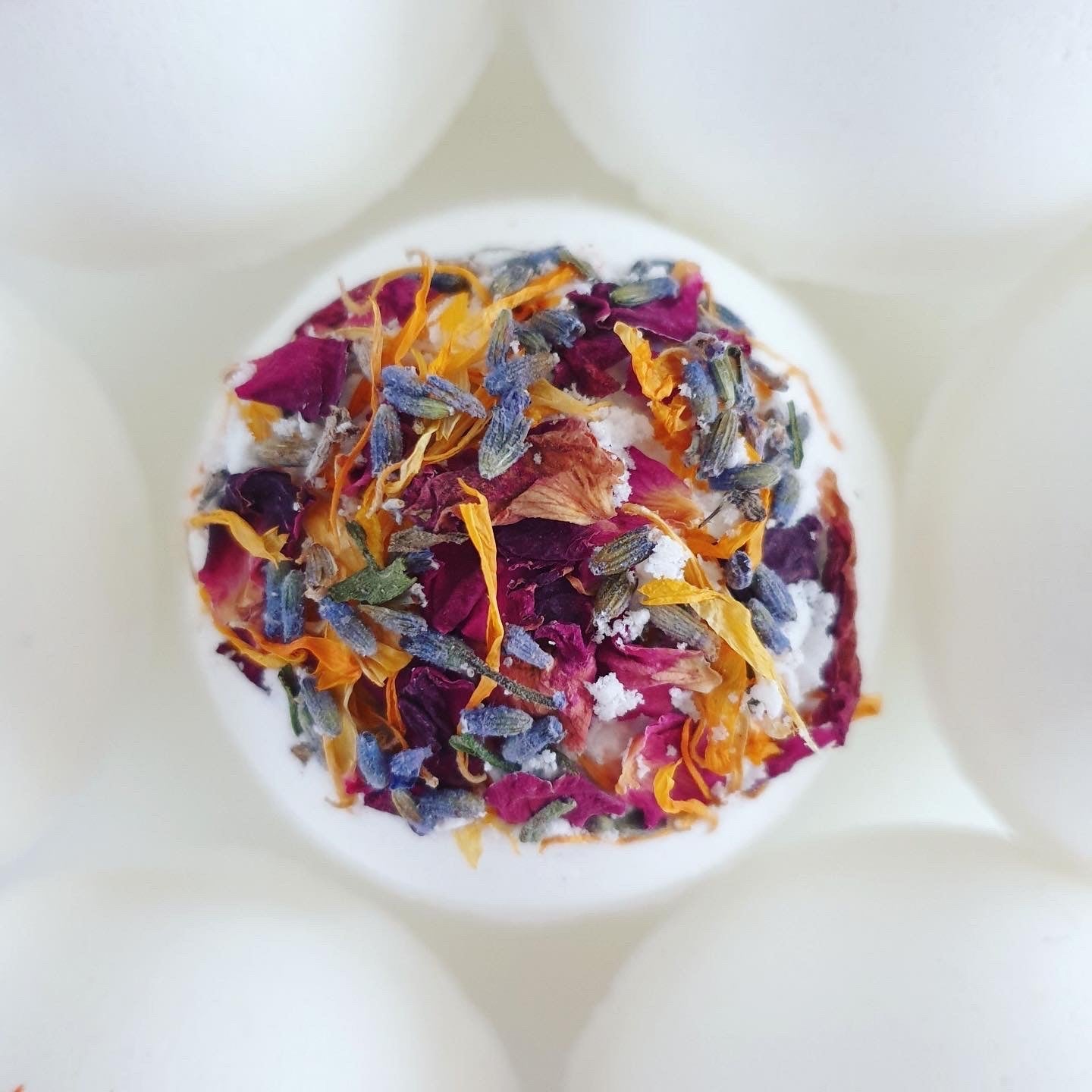 Floral Bath bomb made with colourful dried flower petals for a delightful relaxing bath.