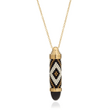 Azuni Black Lynx Totem necklace, a beaded bullet pendant in black, white and gold with a dark gemstone tip.