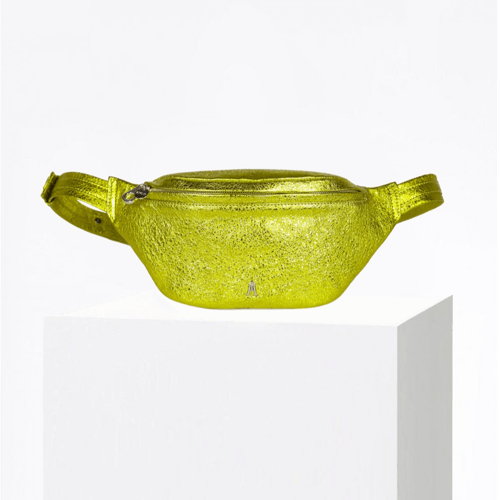 Craie Studio Belt Bag in lemon metallic leather with an adjustable strap, shown on a plinth.