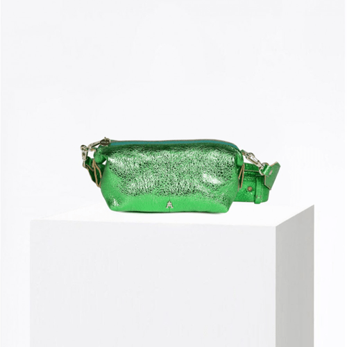 Craie Studio Doudoune belt bag in green metallic bubble leather with an adjustable strap, on a plinth.
