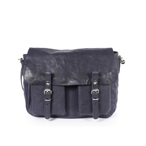 Craie Studio Maths satchel in washed navy-blue leather with two front pockets and buckle straps, on a plinth.