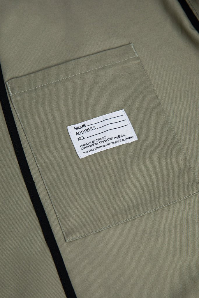 Close-up of the inner pocket with name patch of the Cobrax® Patch Jacket in Light Green by French Iconic Brand CREST