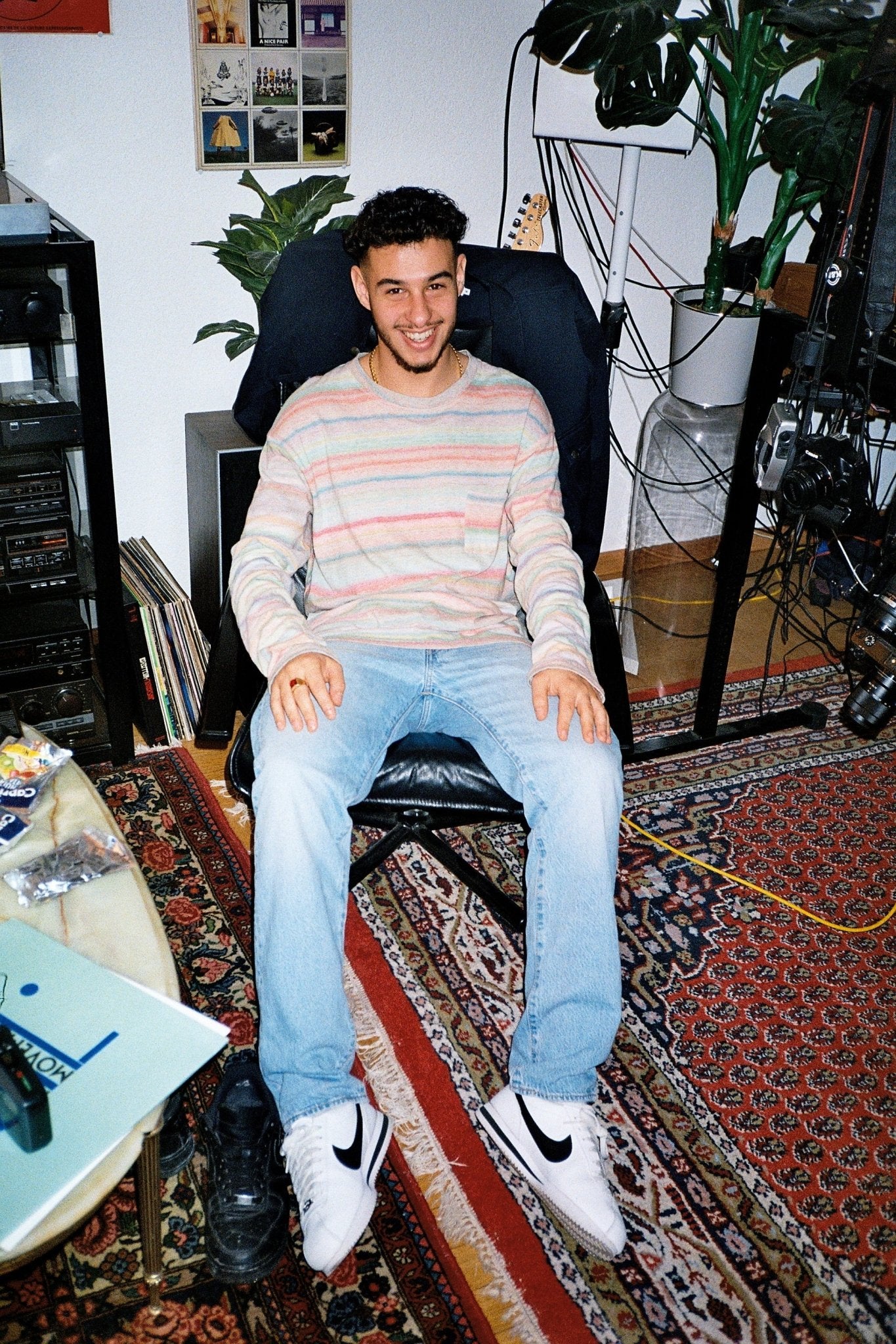 Man wearing the Rainbow Striped Long Sleeved T-Shirt  by French Brand Crest with jeans and Nike Sneakers