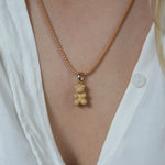Crystal Haze caramel Nostalgia Bear pendant worn on a matching caramel cord necklace.