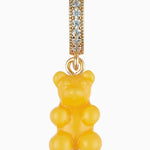 Crystal Haze Pavé Nostalgia Bear pendant in yellow resin on a gold pavé bail, shown on a white background