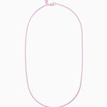Crystal Haze Plastalina necklace in lavender enamel, flat lay on a white background