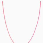 Crystal Haze Plastalina necklace in pink enamel, flat lay on a white background