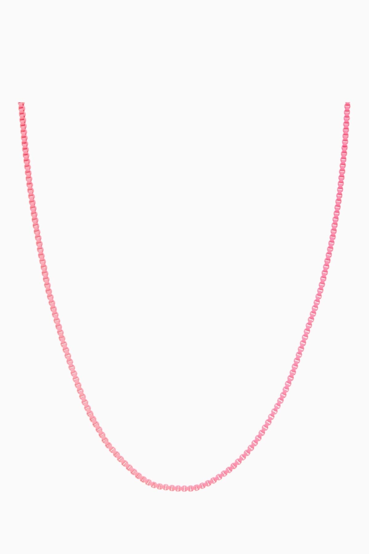 Crystal Haze Plastalina necklace in pink enamel, flat lay on a white background