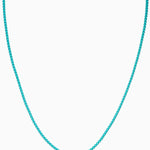 Crystal Haze Plastalina necklace in turquoise enamel, flat lay on a white background