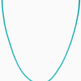 Crystal Haze Plastalina necklace in turquoise enamel, flat lay on a white background
