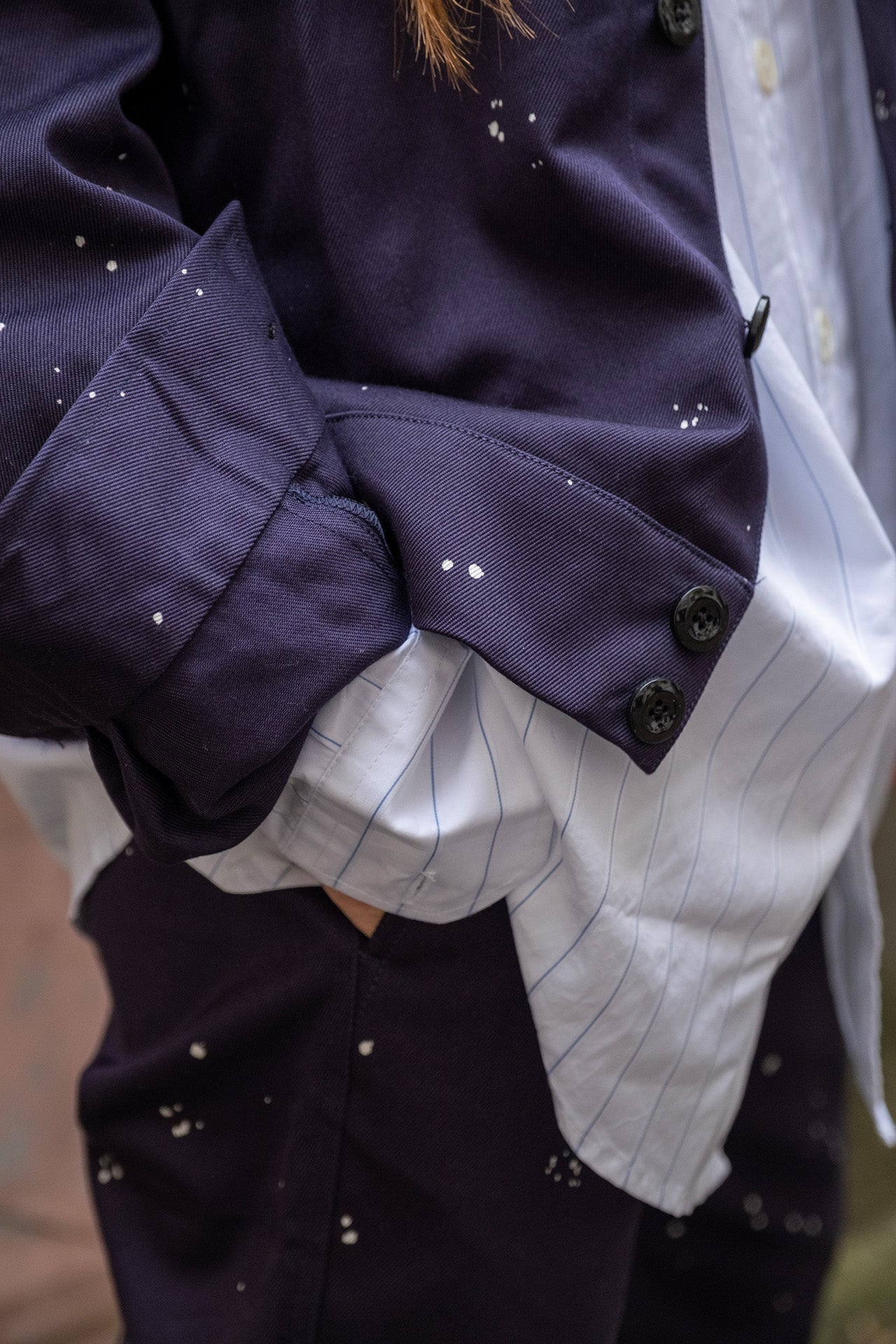 Close-up of hand-painted details on the Crest Men's jacket.