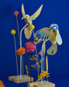 Wooden bird decor, 12 cm high with a 16 cm wingspan, perfect for home or office.