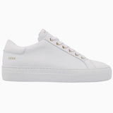 Nubikk Jolie minimalist white leather sneaker with gold eyelets, side profile on a white background.
