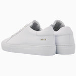 Back view of the Nubikk Jolie white leather sneakers, showing the heel and NBKK logo tab.